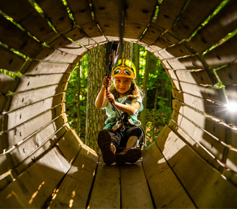 Girl in wooden tunnel